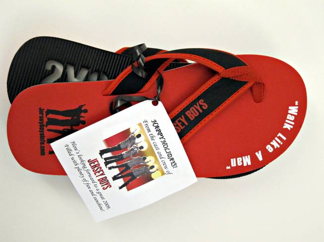 6.&amp; 7. Red rubber "Jersey Boys" flip-flops with white and black detail that read "Walk Like A Man." An estimated men's size 11.