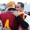 Del Sol High football coach Preston Goroff shares a moment with senior wide receiver Evan Weinstock following the Dragons' 20-19 victory against Basic on Saturday in the Sunrise Regional championship game. 