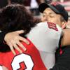 UNLV head coach Mike Sanford embraces Malo Taumua after the team's 24-20 season-ending win against San Diego State on Saturday at Sam Boyd Stadium.