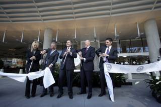 MGM Mirage executives cut a ribbon during the opening of the Vdara on Tuesday, Dec. 1, 2009. From left, Angela Lester, Vdara general manager, Bobby Baldwin, president and CEO of CityCenter, Jim Murren, MGM Mirage chairman/CEO, Bill Grounds, president/COO of Infinity World Development, a subsidiary of Dubai World, and Bill McBeath, president/COO of the Aria. The 57-story, 1,495-suite luxury property is the first to open in MGM Mirage's $8.5 billion CityCenter project. 