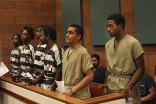 Defendants (from right) Prentice Marshall, 18; Adrian Pena, 17; Saul Williams Jr., 20; Emmitt Ferguson, 18; Michael Ferguson, 25; and Quadrae Scott, 18, appear for arraignment before Justice of the Peace Stephen J. Dahl on Dec. 2, 2009. They are facing charges in connection with the slaying of Metro Police Officer Trevor Nettleton, who was fatally shot in his garage Nov. 19 during what police have called an attempted robbery.