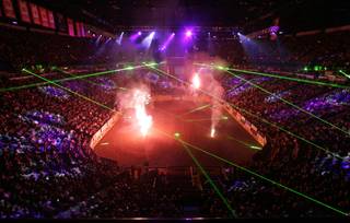 Lasers and pyrotechnics light up the Thomas & Mack Center during the starting ceremony for the 9th go-around of the 2009 National Finals Rodeo Friday, Dec. 11, 2009.