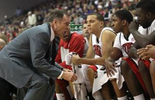 UNLV head coach Lon Kruger gets after his bench during the game Saturday as the Rebels take on Kansas St. at the Orleans Arena.  UNLV dropped their first game of the season 95-80
