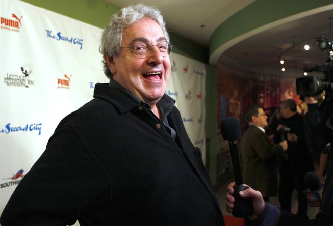  In this Dec. 12, 2009 file photo, actor and director Harold Ramis laughs as he walks the Red Carpet  to celebrate The Second City's 50th anniversary  in Chicago.  An attorney for Ramis said the actor died Monday morning, Feb. 24, 2014, from complications of autoimmune inflammatory disease. He was 69. Ramis is best known for his roles in the comedies "Ghostbusters" and "Stripes." 
