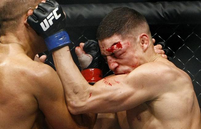 Diego Sanchez tries to defend himself against shots from B.J. Penn during their lightweight championship fight at FedEx Forum in Memphis, Tenn., on Dec. 12, 2009. Penn ended up winning the fight by TKO in the final round.