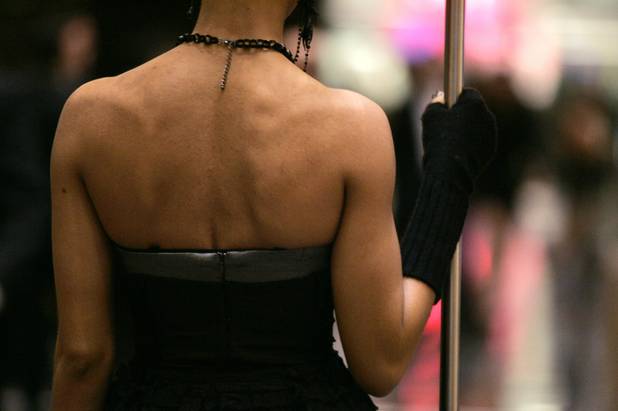 A hired model stands in the lobby during a VIP ...