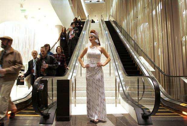 Model and performer Suzie Connor is stationed at the escalators ...