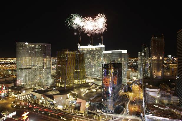 Fireworks explode over the Aria hotel-casino during the official opening ...