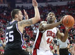 UNLV forward Darris Santee looks to score against Weber State's Trevor Morris during the game Thursday at the Thomas & Mack Center. UNLV came out on top, 72-63.