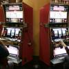  Gamblers play the Hangover-themed slot machines at Caesar's Palace