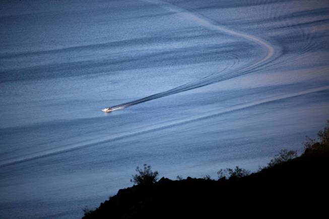 A boat skims the surface of Lake Mead in 2009.