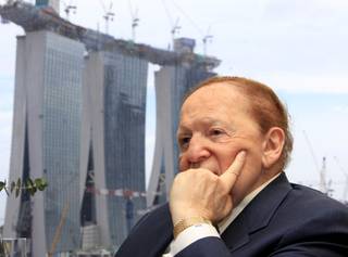 Las Vegas Sands CEO and Chairman Sheldon Adelson speaks during a media briefing with the backdrop of Singapore's Marina Bay Sands on Dec. 21, 2009 in Singapore. 