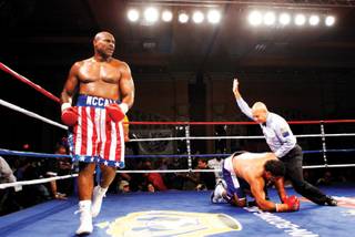THE WINNER IS ... Oliver McCall walks around the ring as referee Joe Cortez calls off the heavyweight fight May 22 with John Hopoate of Australia at the Orleans. McCall beat Hopoate, a former rugby player, with a second-round knockout.