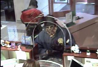 Surveillance video image of a man wanted in connection with the Nevada State Bank robbery.