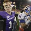 TCU quarterback Andy Dalton, left, pats the helmet of Boise State quarterback Kellen Moore following the Broncos' 17-10 victory over the Horned Frogs in the Fiesta Bowl in January.