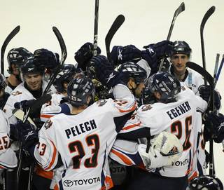 Ontario Reign players come together to celebrate an overtime victory over the Las Vegas Wranglers at the Orleans Arena on Friday night.
