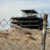 Rusted pipes and fencing surround the halted construction site of the Shops at Summerlin Centre January 7, 2009.