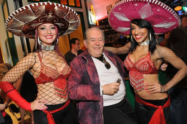 Robin Leach, center, at the grand opening of Hussong's Cantina ...