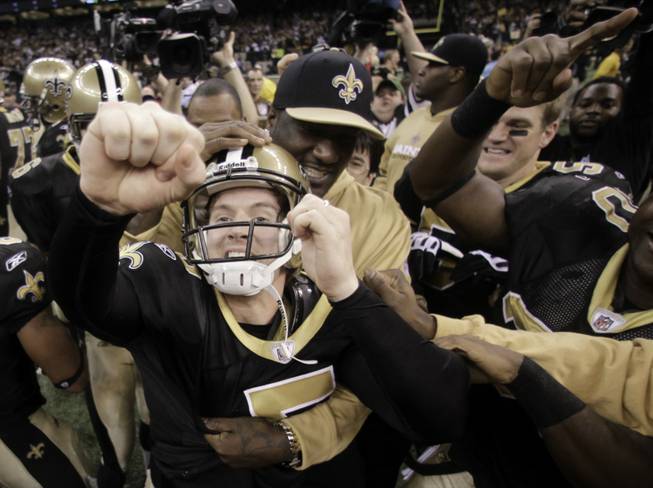 New Orleans Saints kicker Garrett Hartley (5) celebrates with his teammates after kicking the winning field goal during overtime in the NFC Championship NFL football game in New Orleans, Sunday, Jan. 24, 2010. The Saints defeated the Vikings 31-28 to advance to the Super Bowl against the Indianapolis Colts.
