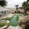 A stagnant pool is shown in Ventana Canyon in Henderson, whose homeowners association was sued by investors. 