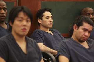 Porfirio Duarte-Herrera, center, sits in court waiting to be called for sentencing before District Court Judge Michael P. Villani Thursday at the Regional Justice Center.  Duarte-Herrera was sentenced to life without parole for the Luxor bombing that killed Willebaldo Dorantes Antonio in May 2007.