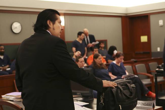 Defense attorney Charles Cano speaks on behalf of his client, Porfirio Duarte-Herrera, center, during his sentencing hearing before  District Court Judge Michael P. Villani Thursday at the Regional Justice Center.