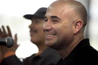 Musician Carlos Santana visits with Andre Agassi at The Andre Agassi College Preparatory Academy in Las Vegas Thursday, February 4, 2010.