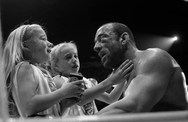 To calm the tears and fears of his daughters, Mark Coleman repeats over and over that "Daddy's OK. Daddy's OK," after being defeated by Fedor Emelianenko in the second round of their heavyweight bout at Pride Fighting Championships first U.S. event, "The Real Deal," at the Thomas & Mack Center. When his repeated reassurance that "Daddy's OK, it's all over. It's all over. Daddy's OK. Let's go have some fun now," failed to completely calm the girls, Coleman took them to center ring and introduced them to the man who turned his face into a bloody pulp. Then, after a minute or two of talk, Coleman playfully tagged the Russian champion with light tap to the chin and then raised his arms in victory.