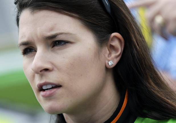 Driver Danica Patrick talks with her crew after qualifying for ...