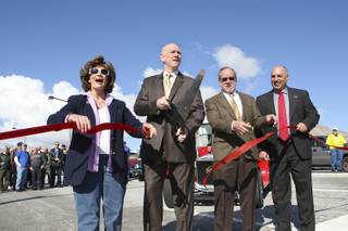 Distinguished guests kick off the opening of the Las Vegas Beltway between Charleston Boulevard and Summerlin Parkway during the ribbon-cutting ceremony Wednesday, Feb. 10.  From left, Rep. Shelley Berkley, County Commissioner Larry Brown, Public Works Director Denis Cederburg and Councilman Stavros Anthony.
