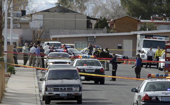 Officials investigate a homicide scene involving an assault that left a child dead near San Pedro Avenue and 17th Street Thursday, Feb. 11, 2010. 