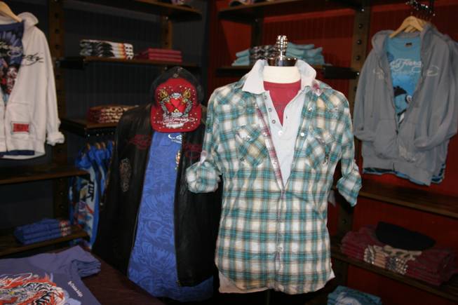 Christian Audigier clothing and products on display at the MAGIC convention.