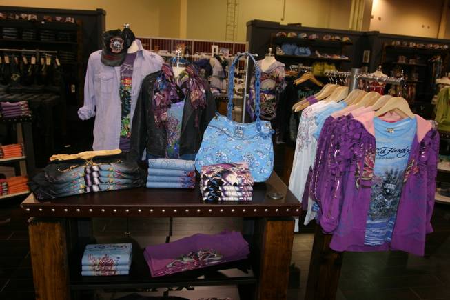 Christian Audigier clothing and products on display at the MAGIC convention.
