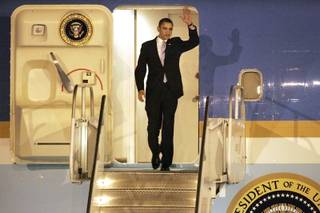 President Barack Obama exits Air Force One after arriving at McCarran International Airport in Las Vegas on Thursday.