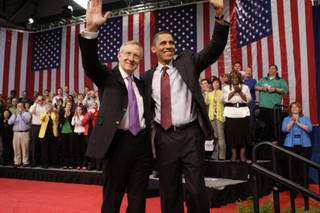Senate Majority Leader Harry Reid (D-Nev.) and President Barack Obama wave as they conclude a town hall meeting at Green Valley High School in Henderson Friday, February 19, 2010.