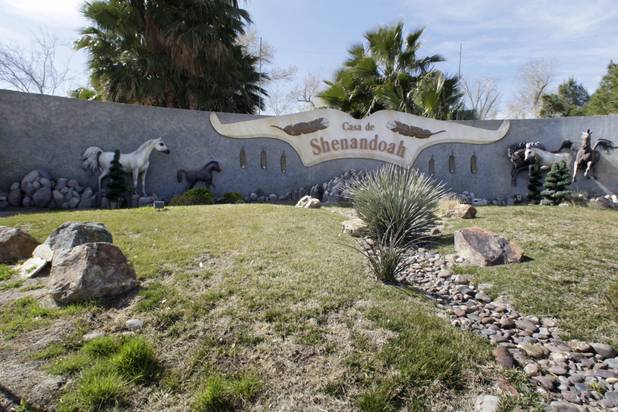A view of the wall at the corner of property owned by entertainer Wayne Newton in Las Vegas Thursday, Feb. 25, 2010. Moving vans accompanied by official-looking vehicles arrived at the home of Las Vegas entertainer Wayne Newton this morning but left soon after without removing anything. Metro Police said they weren't commenting on the case. 