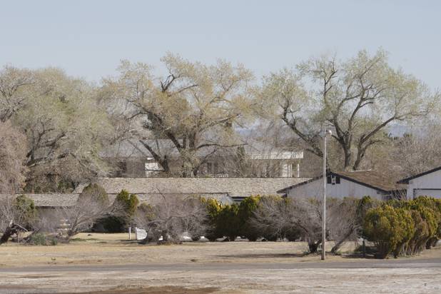 Property and a home (seen behind the trees) owned by entertainer Wayne Newton is shown in Las Vegas Thursday, Feb. 25, 2010. Moving vans accompanied by official-looking vehicles arrived at the home of Las Vegas entertainer Wayne Newton this morning but left soon after without removing anything. Metro Police said they weren't commenting on the case. 
