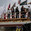 Sam Schlientz and his tailgating crew watch Friday&#39;s qualifying runs from a wooden deck they built three years ago.
