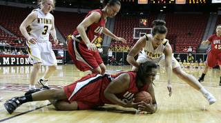 UNLV center Markiell Styles hits the ground after diving for a loose ball against Wyoming during the second half of Tuesday's Mountain West Conference tournament game at the Thomas & Mack Center. Wyoming won the game 60-55.