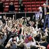 San Diego State coach Steve Fisher salutes fans with the net after their Mountain West Conference championship game against UNLV Saturday, March 13, 2010. San Diego State won the game 55-45.