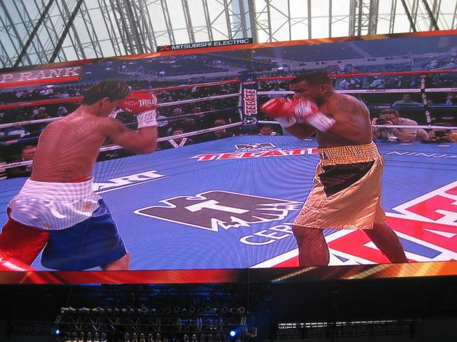 A look at Round 1 of the first fight, between Mauricio Pastrana and Eden Sonsona (bantamweights), as seen from the stands, on the Cowboys Stadium big screen.