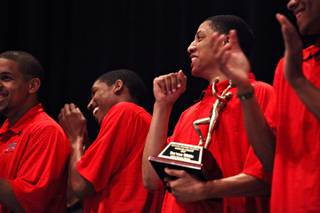 Tre'Von Willis, center right, is named the team's most valuable player, voted by his teammates, during the team's end-of-season banquet on Sunday, March 14, 2010, at Cox Pavilion.