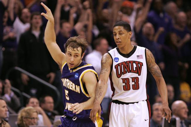 UNI guard Ali Farokhmanesh signals his game winning three-point shot as he pushes his way past UNLV guard Tre'Von Willis during their first round NCAA Basketball Tournament game Thursday, March 18, 2010 at the Ford Center in Oklahoma Ctiy. UNI won the game 69-66 on a last second three-point shot.