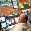Bettor Stacy Hofferber of Las Vegas relaxes in the sports book at M Resort with the touch-screens offering betting during live basketball games at left in cubicle. 