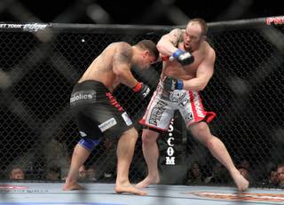 Shane Carwin, right, in action against Frank Mir during their heavyweight match at the Prudential Center in Newark, N.J., on Saturday, March 27, 2010.  Carwin won at 3:28 of the first round to take the UFC interim heavyweight title.