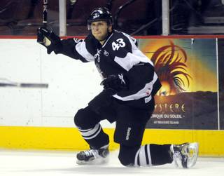 Recently reassigned to the Wranglers, Ned Lukacevic celebrates scoring his second goal of the night with seconds left in the second period against the Ontario Reign on Thursday night.