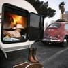 Robert Boudreau of Riverside, Calif., rests inside his camper hauled by his classic Volkswagen Bug at the Las Vegas KOA at Circus Circus.  Boudreau goes to car shows with his Bug themed in different ways, and he was headed to a car show in Boulder City the next day with a cowboy theme.