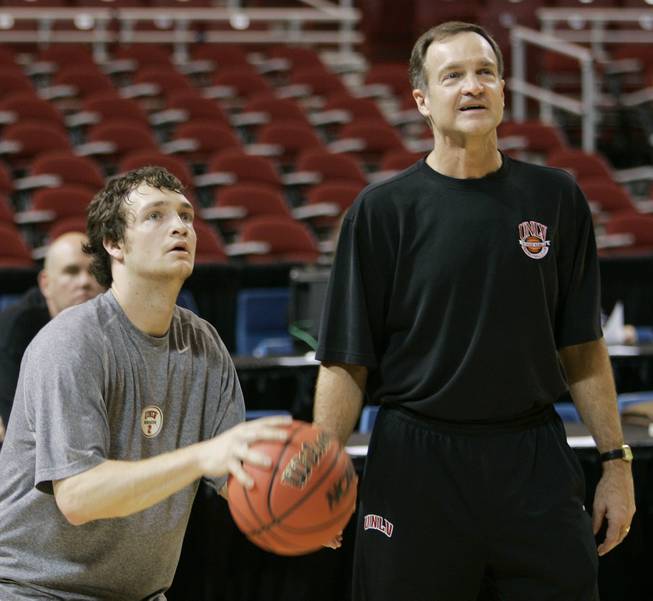 UNLV guard Kevin Kruger shoots while his father, Rebels coach Lon Kruger, looks on as the team prepared for its Sweet Sixteen contest against Oregon in St. Louis on March 22, 2007.
