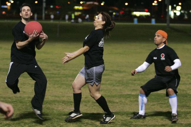 New Kickballers on the Block members Jordan Tayce (L) Tanya Abel and James Steinert converge to field a ball during the World Adult Kickball Association's first game of the season Wednesday, April 14, 2010 at Desert Breeze Park.
