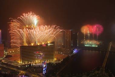 The Encore Macau grand opening fireworks illuminate the night sky above Wynn Macau on April 21, 2010.